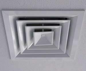 Closeup of a ceiling exhaust fan.