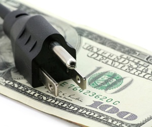Energy saving concept of power plug and dollar bill.