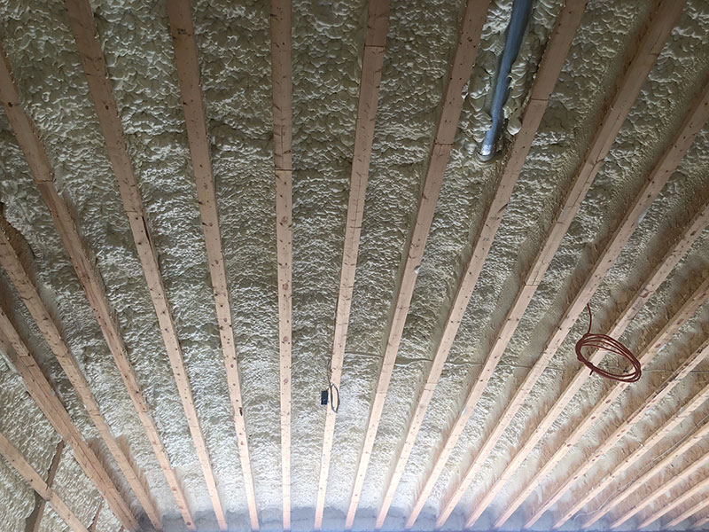 Spray foam insulation in a ceiling.