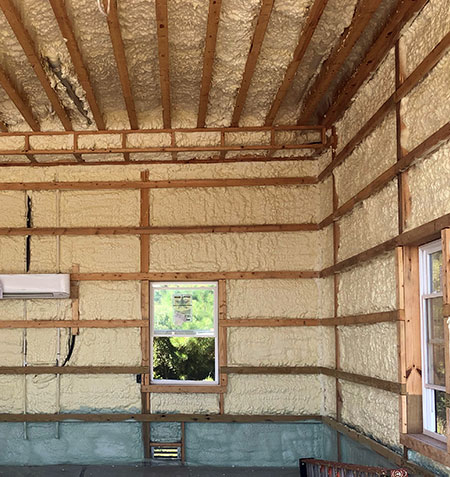 Exterior-Wall-Insulation-2 Insulated room interior with foam-filled walls and wooden beams